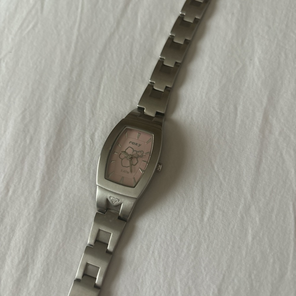 Silver analogue watch with pink watch face from Roxy